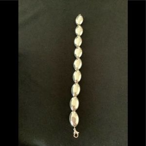 Really nice 8” Sterling bracelet, smooth ovals of silver slide on a silver chain